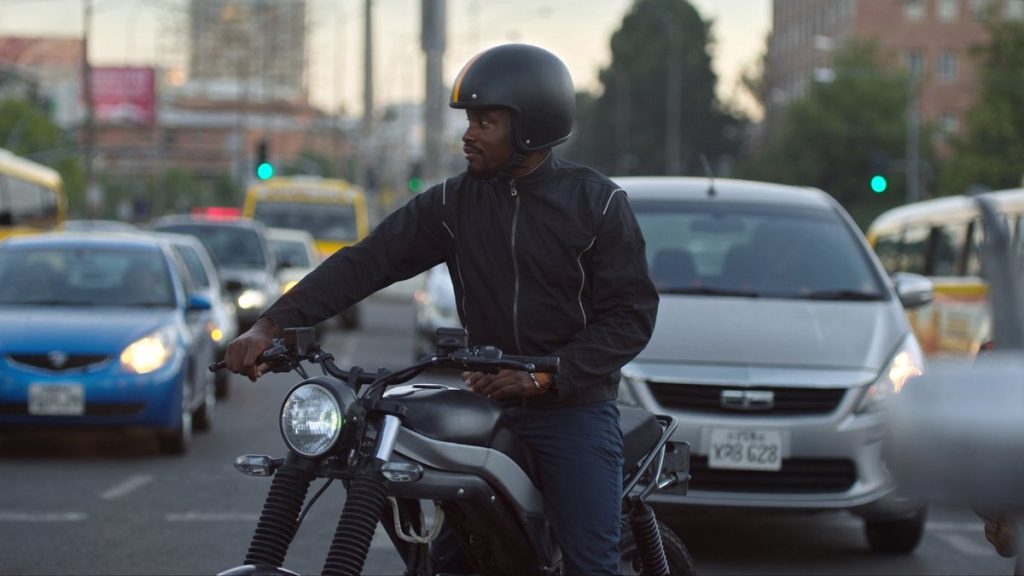 Rider on a mid-size commuter motorcycle in Johannesburg traffic, the riding Honda E-Clutch is built for