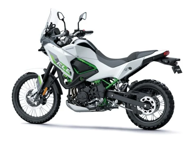 Rear three-quarter view of the white Kawasaki KLE500 SE showing the stepped seat, grab rails, spoked wheels and under-engine exhaust