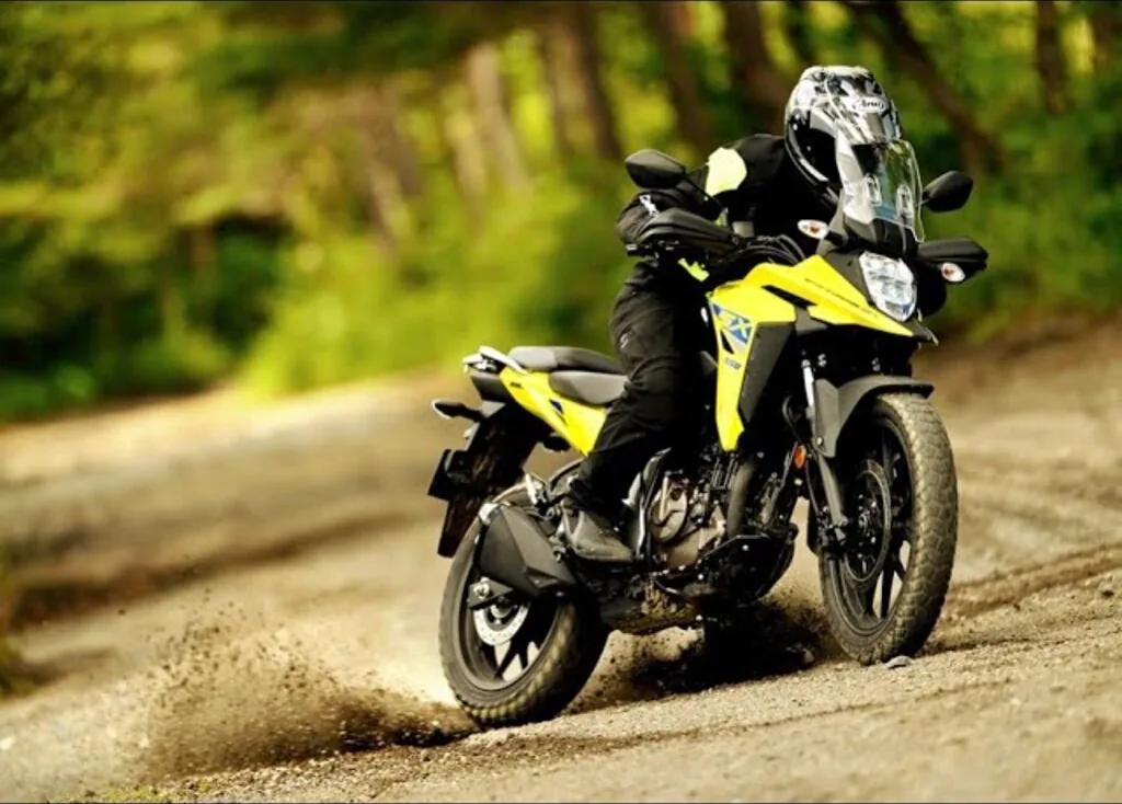 Suzuki V-Strom DS 250 SX riding on a gravel district road