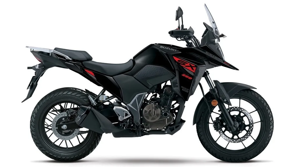 Suzuki V-Strom DS 250 SX side profile showing the 19 inch front wheel, bash plate and hand guards