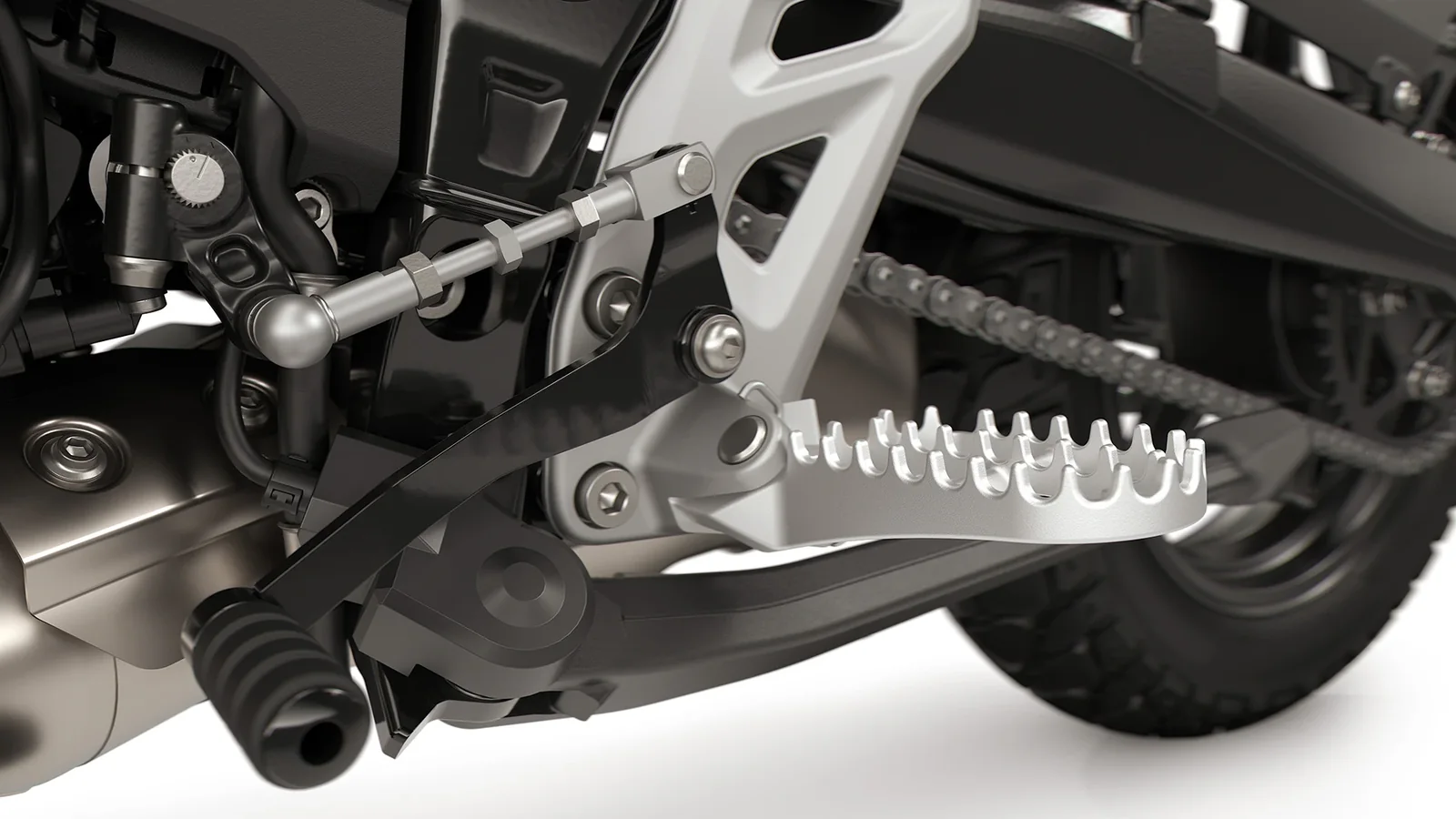 Close-up of the serrated off-road footpeg, gear lever and quickshifter linkage on the BMW F 450 GS