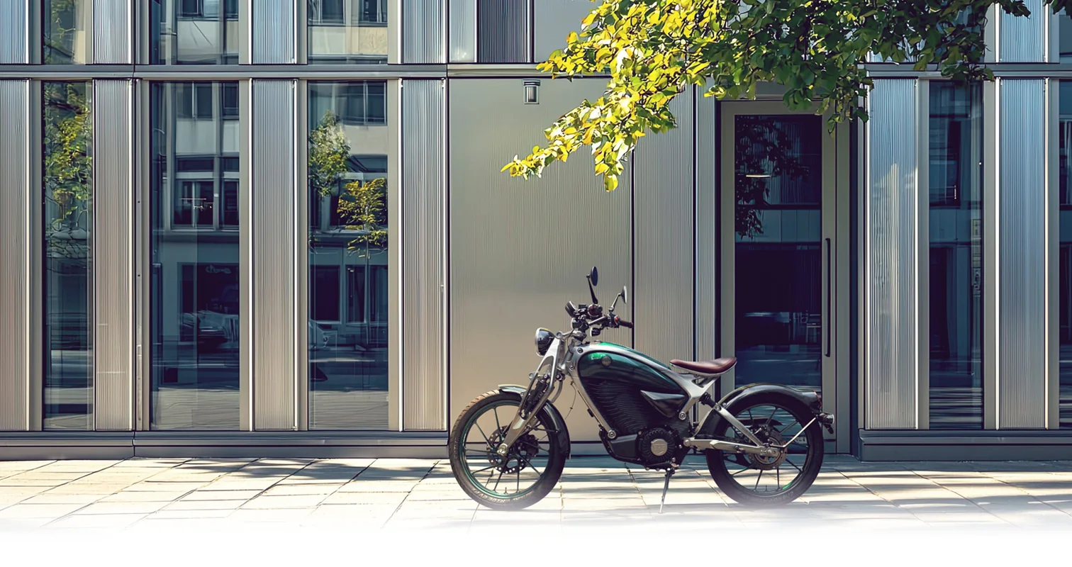 Flying Flea C6 in Flea Green parked on paving outside a glass and steel office building under a tree