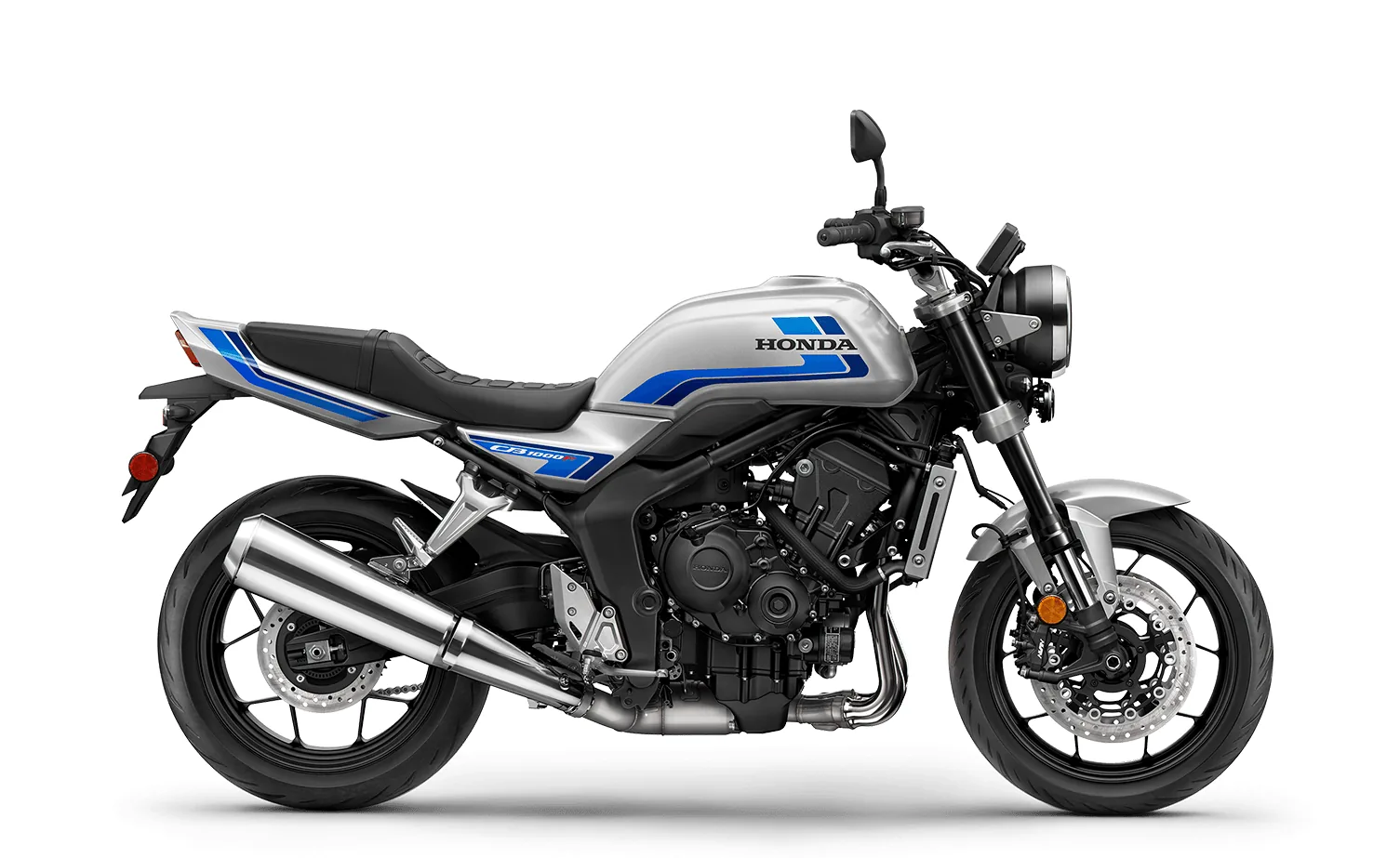 2026 Honda CB1000F studio side profile, right-hand side, in Wolf Silver Metallic with blue graphics, showing the megaphone exhaust, steel frame and 17 inch cast wheels