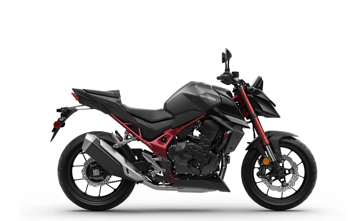 Studio side profile of the 2026 Honda CB750 Hornet E-Clutch in black with a red frame, red fork, twin front discs and black cast wheels