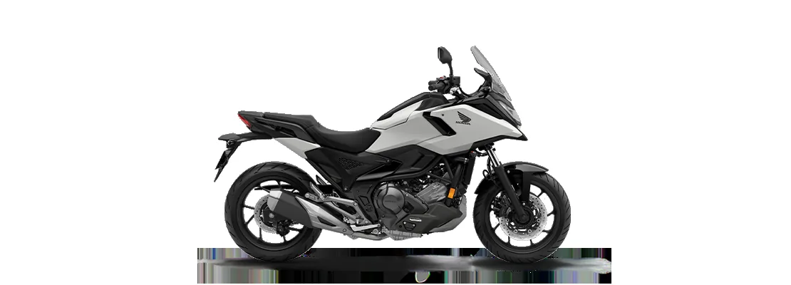 Side profile of the Honda NC750X in Matte Pearl Glare White with black panels on a white background