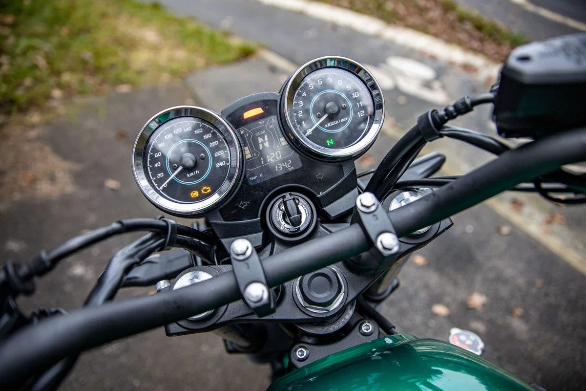 Rider view of the Kawasaki Z650RS twin analogue speedometer and rev counter with a central LCD showing gear position and fuel