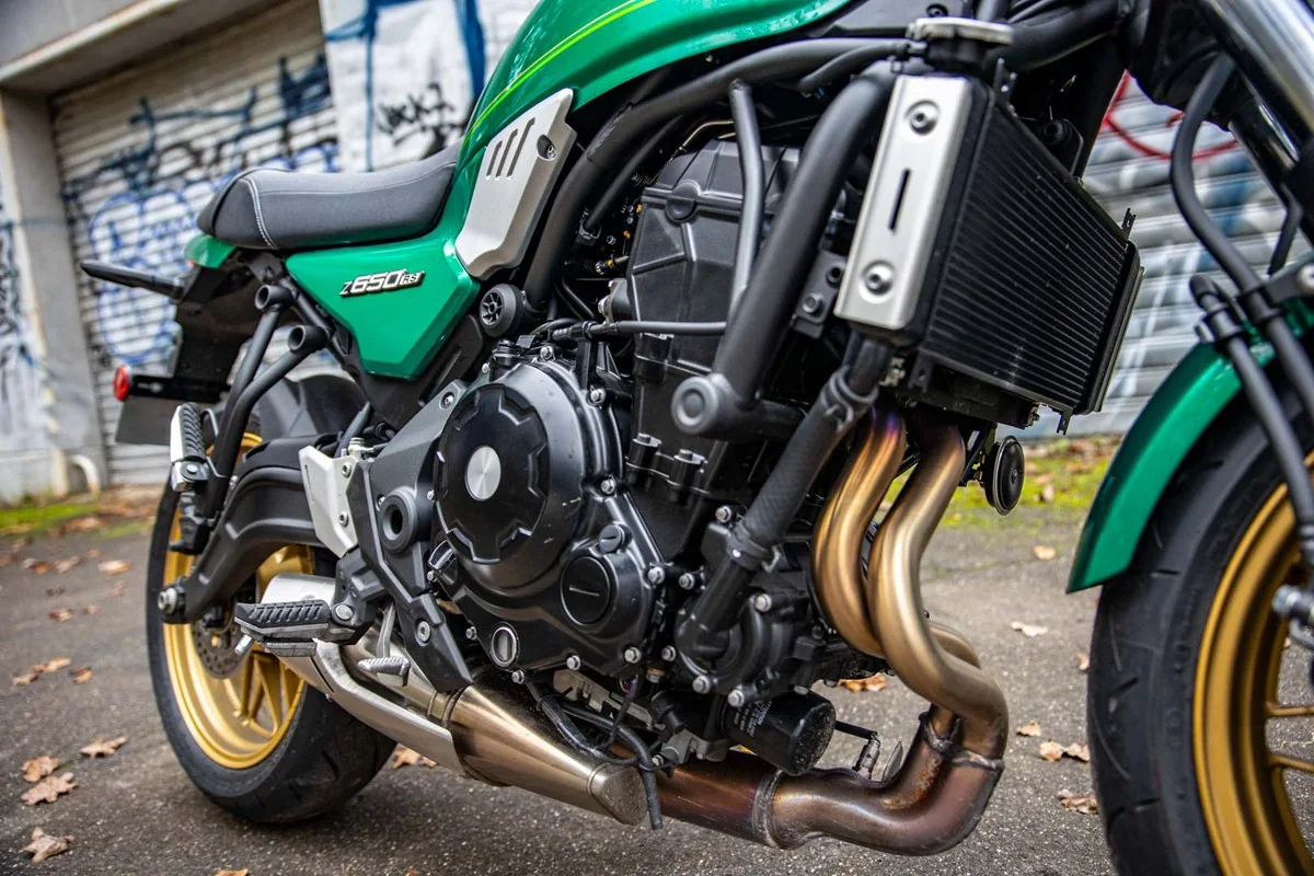 Close-up of the Kawasaki Z650RS 649cc parallel twin engine, radiator and bronze-coloured exhaust headers