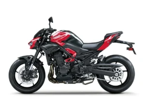 Left side profile of the 2026 Kawasaki Z900 ABS in Candy Persimmon Red and black with the steel trellis frame, inline four engine, 41 mm upside-down fork and twin front discs
