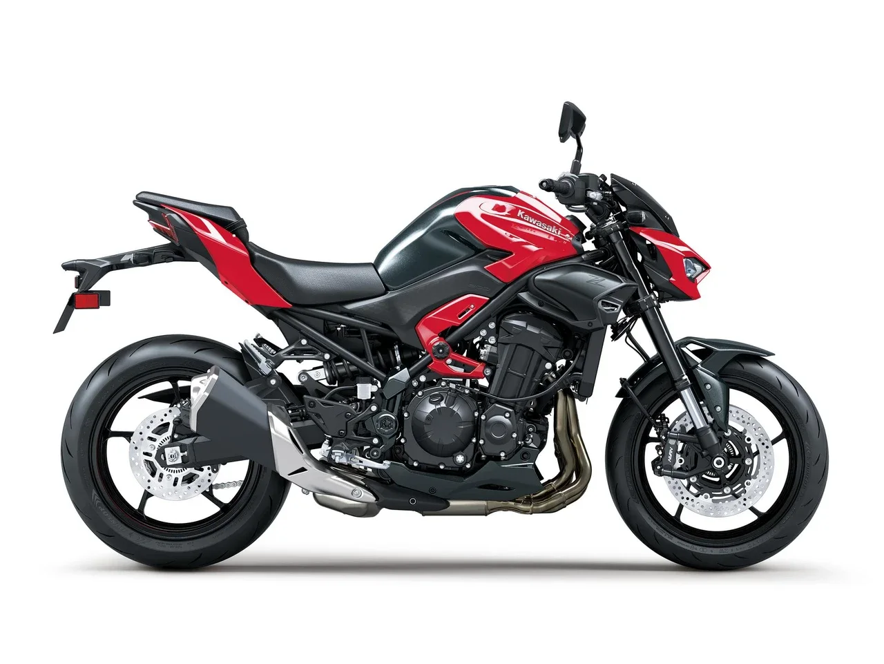 Right side profile of the 2026 Kawasaki Z900 ABS in Candy Persimmon Red showing the underbelly exhaust, radial Nissin front calipers and 180-section rear tyre