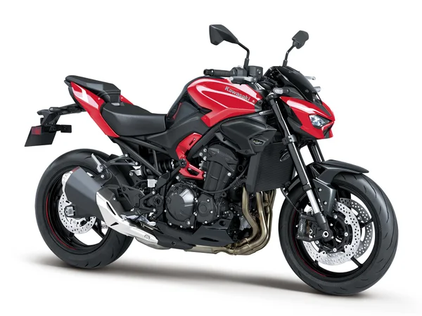 Front three-quarter studio view of the 2026 Kawasaki Z900 ABS in Candy Persimmon Red with compact LED headlight