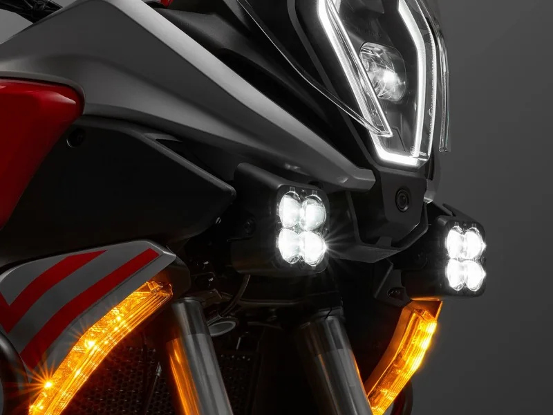 Close-up of the QJMotor SRT 600 LED headlight with its daytime running light surround, twin four-LED auxiliary lamps and amber indicators